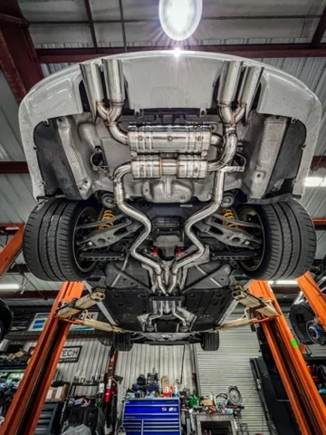 BMW Performance catless downpipe upgrade on a BMW M3 F80 at European Motor Gruppe in Houston